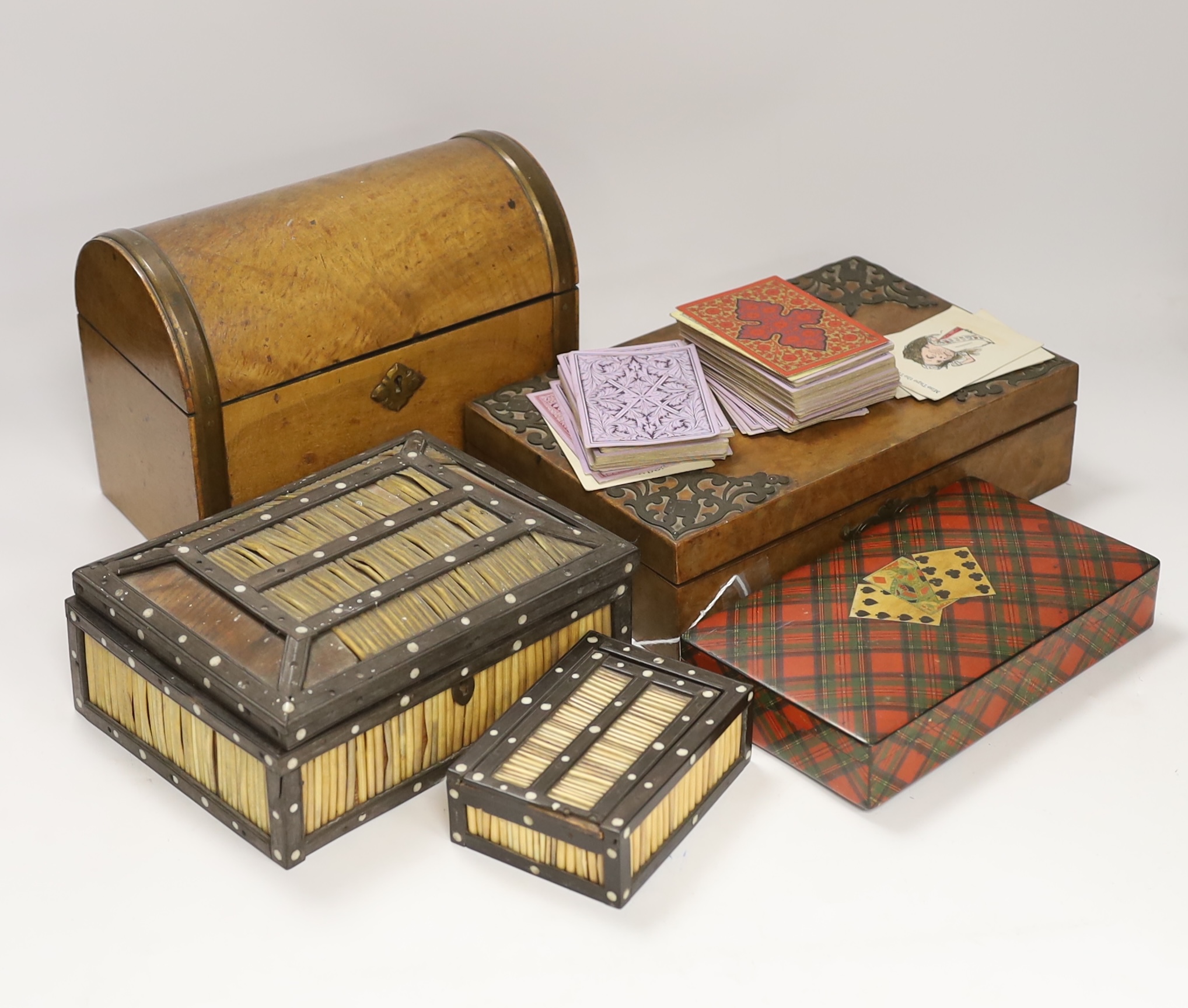 A Tartanware games case, a burr walnut compendium, a dome topped stationery box and two quill boxes, largest 22cm wide x 17cm high